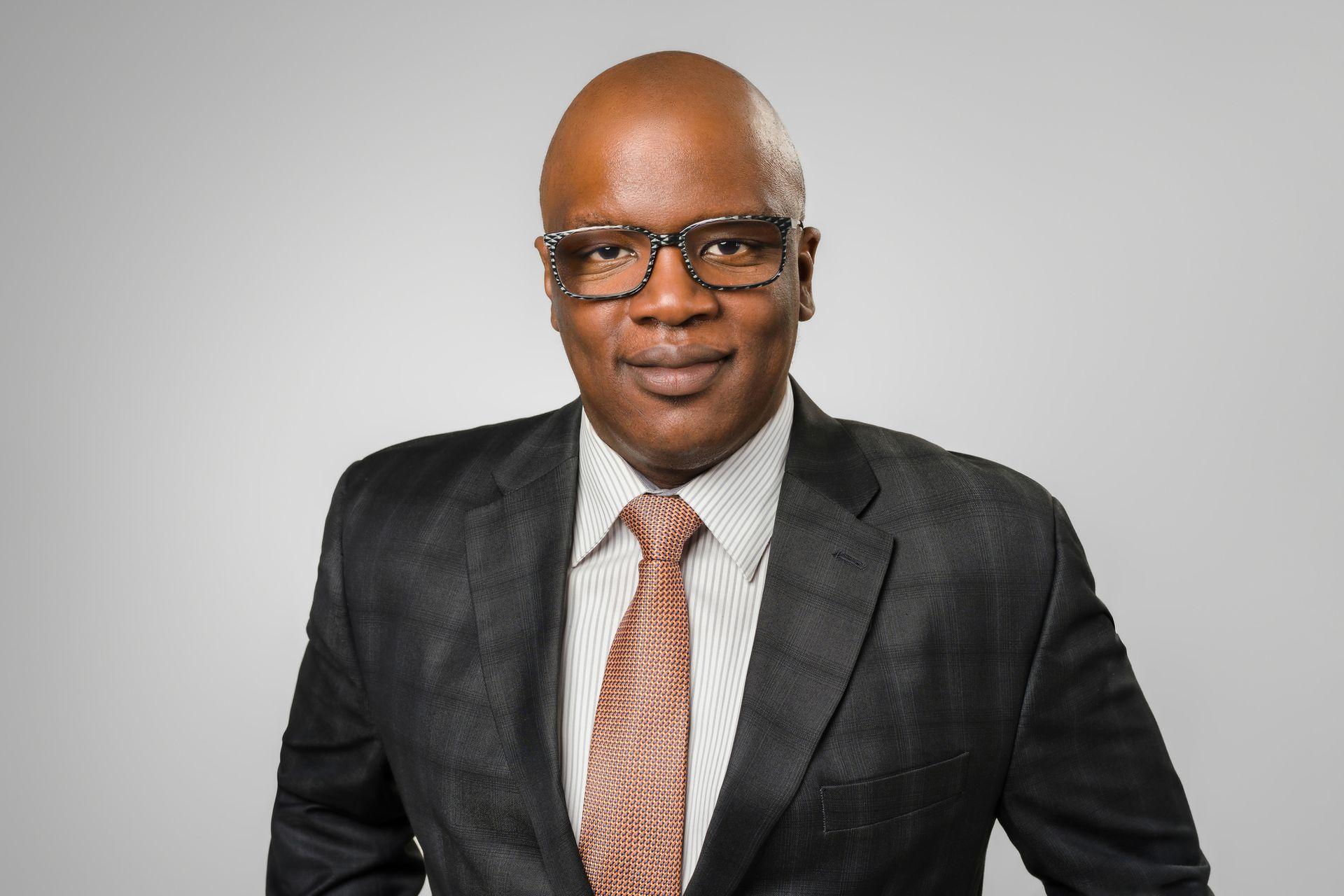 Handsome attorney with glasses in dark suit with tie